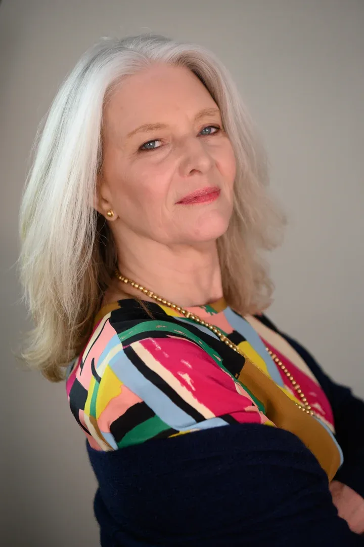 Profile of Patricia A. Tracy smiling against a light background.