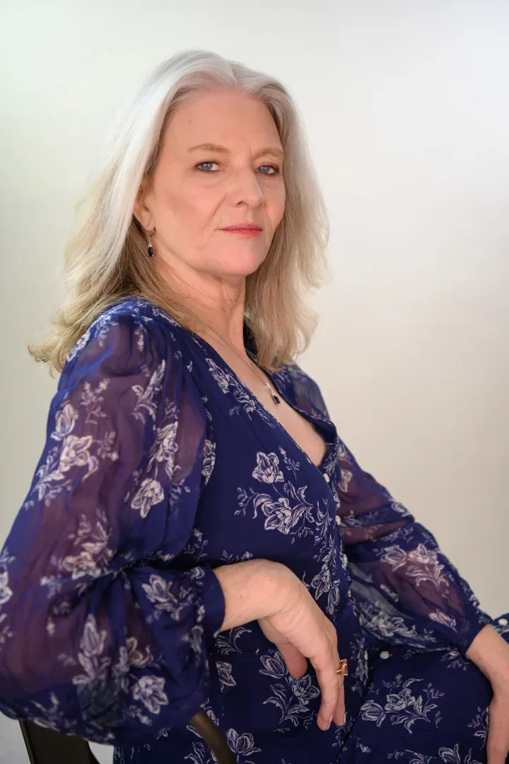 Patricia A. Tracy friendly in a lace-overlay navy dress.